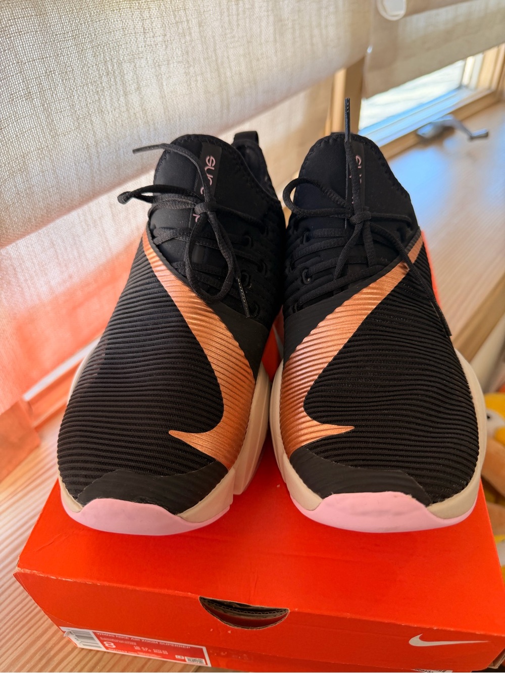 Nike Black Athletic Shoes with Copper Swoosh